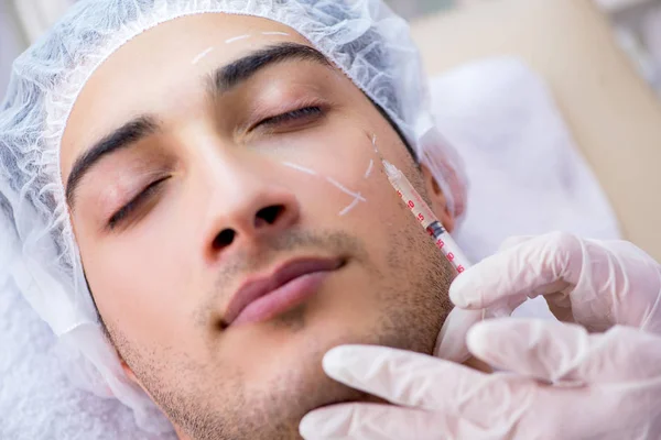 Man visiting doctor for plastic surgery