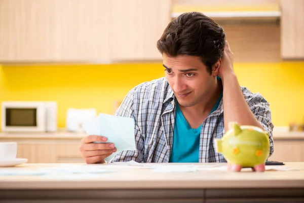 Young man husband in budget planning concept — Stock Photo, Image