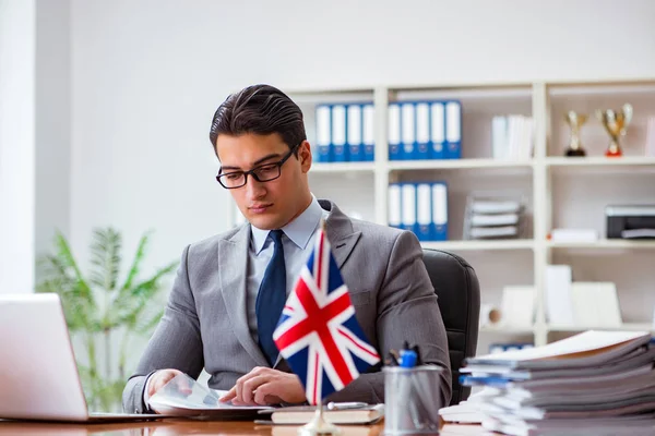 Businessman with British flag in the office — Stock Photo, Image