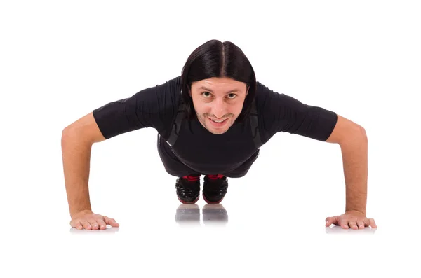 Young man doing exercises isolated on white — Stock Photo, Image