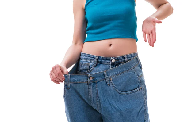 Concept of dieting with oversized jeans — Stock Photo, Image