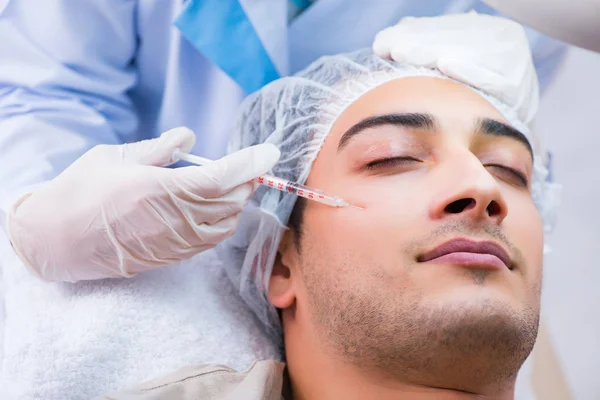 Man visiting doctor for plastic surgery