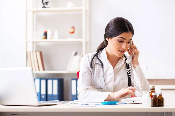 Doctor in telemedicine concept with phone — Stock Photo, Image