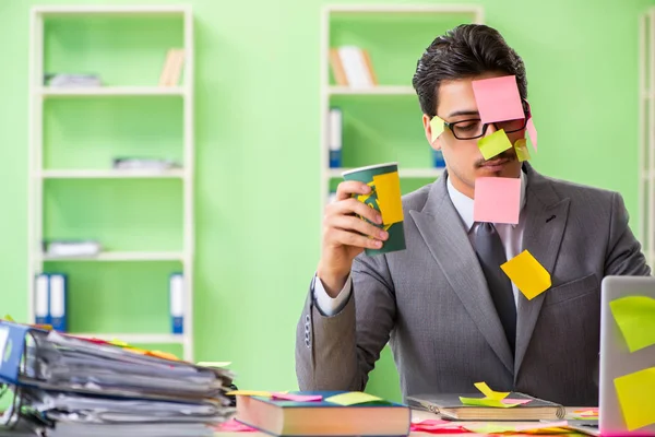 Businessman unhappy with many conflicting priorities sitting in — Stock Photo, Image