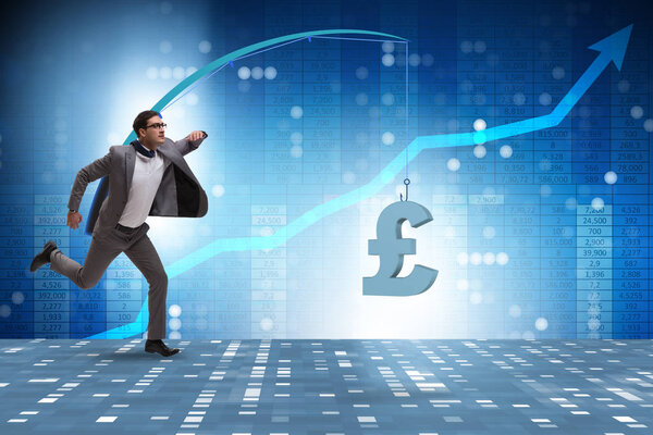 Businessman chasing money on fishing rod