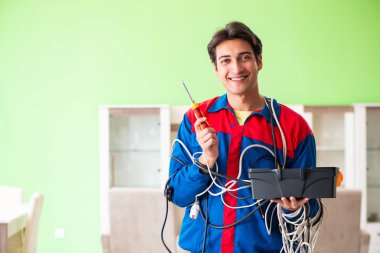 Electrician contractor with tangled cables clipart