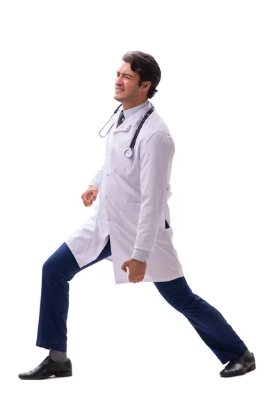 Jonge knappe dokter onder druk geïsoleerd op wit — Stockfoto