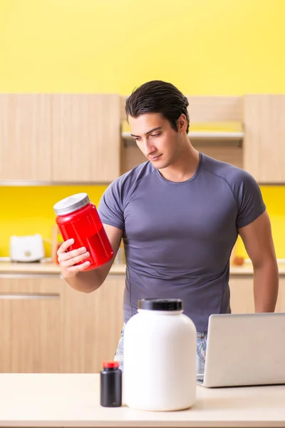 Young man blogging about food supplements — Stock Photo, Image