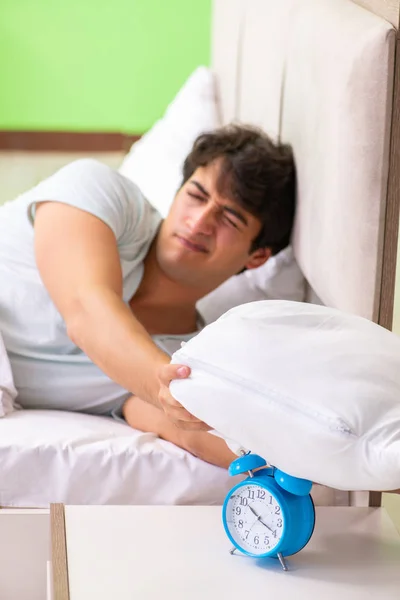 Young man having trouble waking up in early morning — Stock Photo, Image