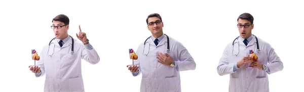 Young doctor with heart shape isolated on white — Stock Photo, Image