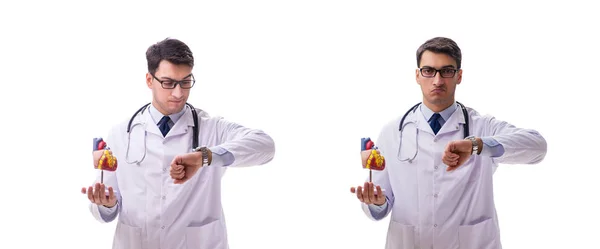 Young doctor with heart shape isolated on white — Stock Photo, Image
