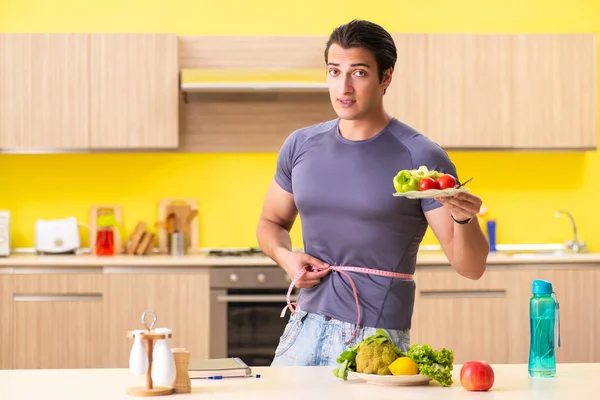 Young man in dieting and healthy eating concept