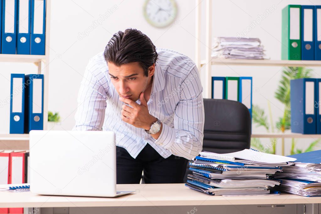 Young employee sitting at the office 