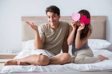 Happy couple in the bed clipart
