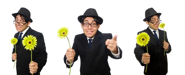 Jonge man in zwart kostuum met bloem geïsoleerd op wit — Stockfoto