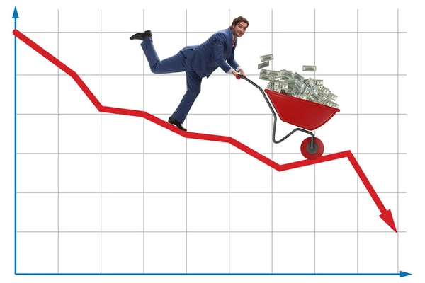 Affärsman trycka pengar skottkärra ner diagrammet — Stockfoto