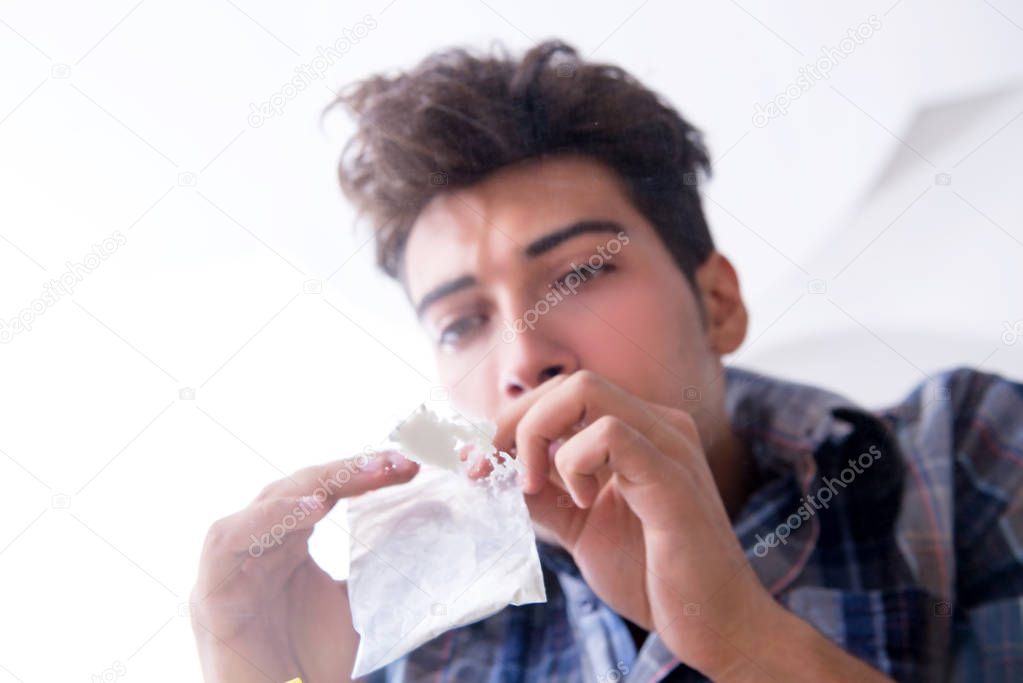 Drug addict sniffing cocaine narcotic