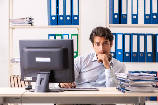 Overloaded busy employee with too much work and paperwork — Stock Photo, Image