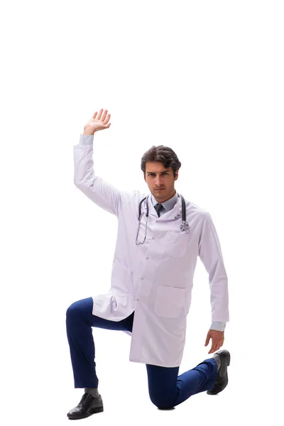 Jonge knappe dokter onder druk geïsoleerd op wit — Stockfoto