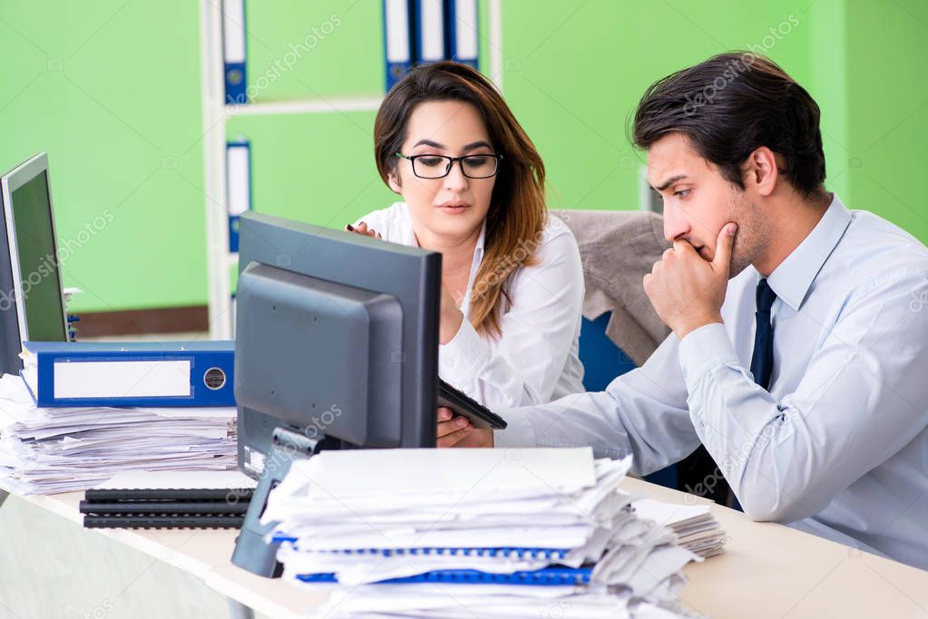 Two financial specialists working in the office