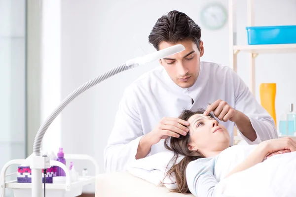 Doctor measuring patients face before plastic surgery — Stock Photo, Image
