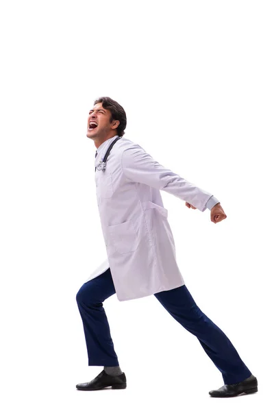 Young handsome doctor under pressure isolated on white — Stock Photo, Image
