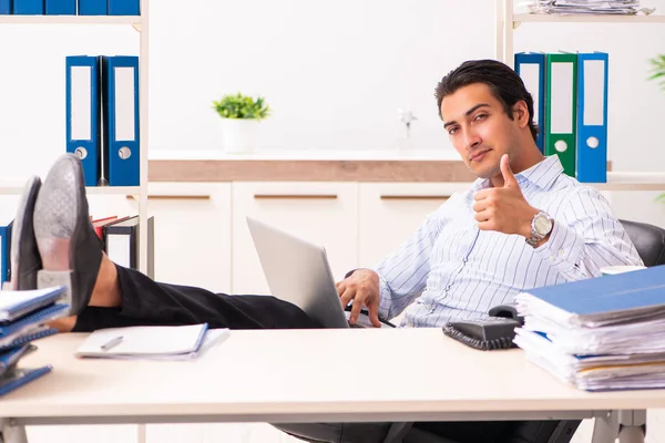 Young employee sitting at the office — Stock Photo, Image