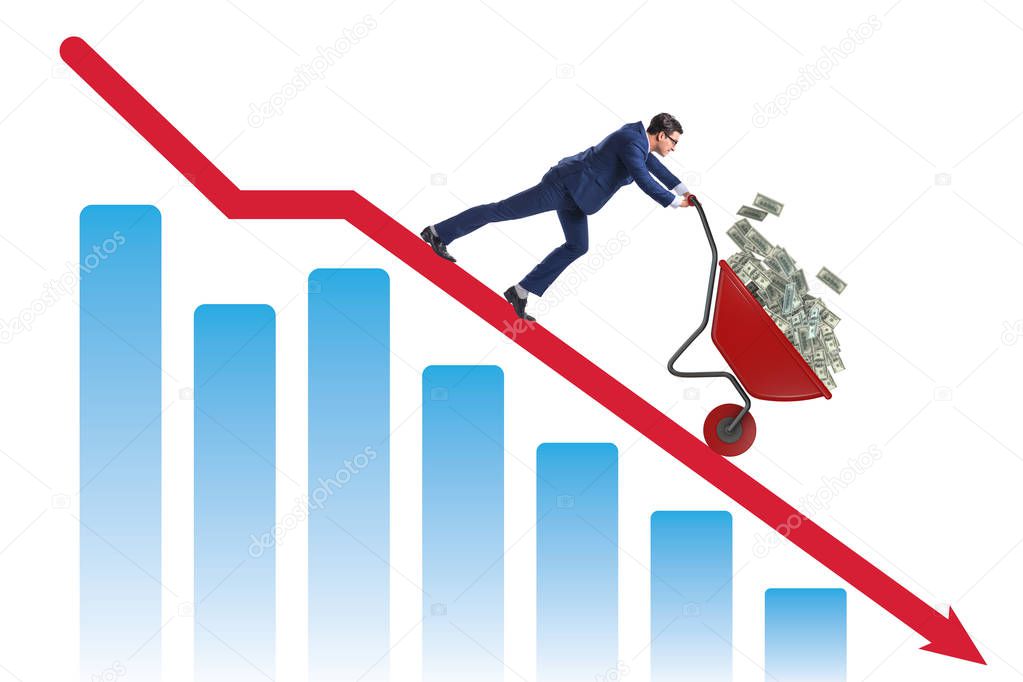 Businessman pushing money wheelbarrow down the chart