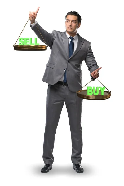 Businessman choosing between buying and selling — Stock Photo, Image