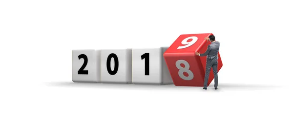 Businessman employee rotating cube to reveal number 2019 — Stock Photo, Image