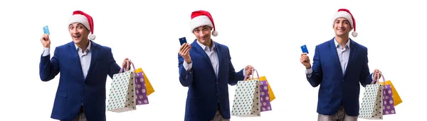 Jongeman met tassen na kerst winkelen op witte achtergrond — Stockfoto