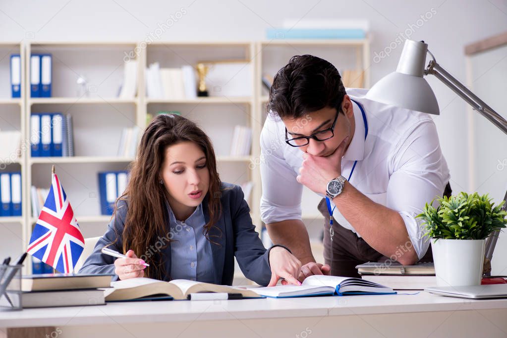 Teacher explaining to student at language training