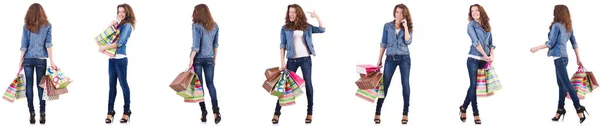 Ung kvinna med shoppingväskor isolerade på vitt — Stockfoto