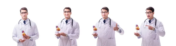 Médico joven con forma de corazón aislado en blanco —  Fotos de Stock