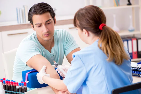 Young patient during blood test sampling procedure — Stock Photo, Image