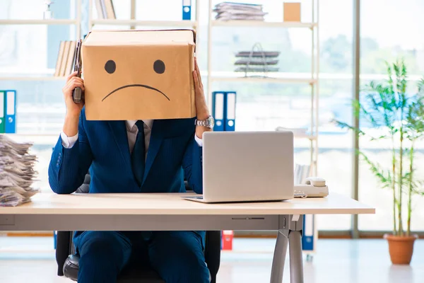 Unhappy man with box instead of his head — Stock Photo, Image