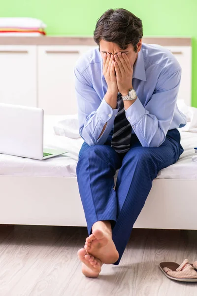 Businessman working overtime in hotel room — Stock Photo, Image