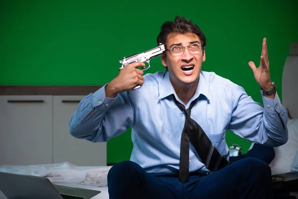 Young businessman under stress in the bedroom at night — Stock Photo, Image