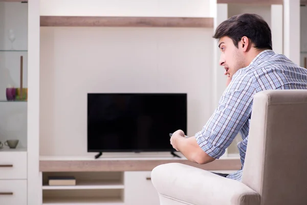 Young man watching tv at home — Stock Photo, Image