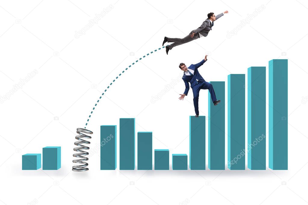 Businessman outperforming his competition jumping over