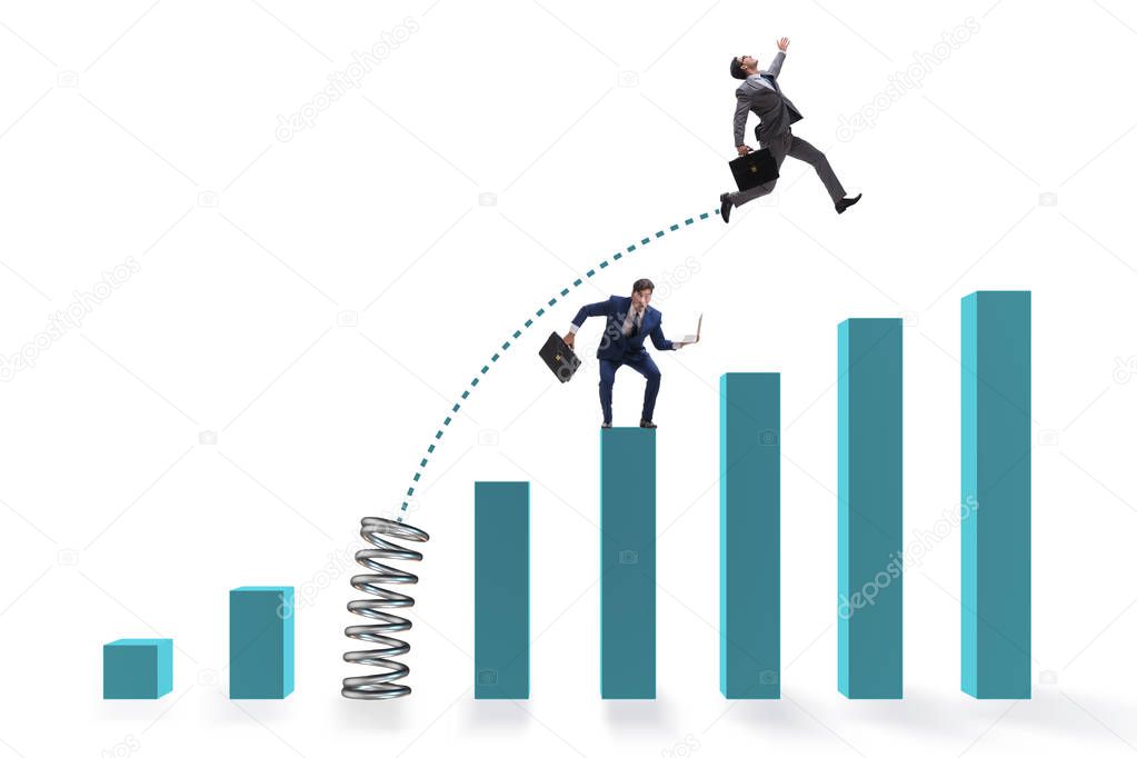 Businessman outperforming his competition jumping over