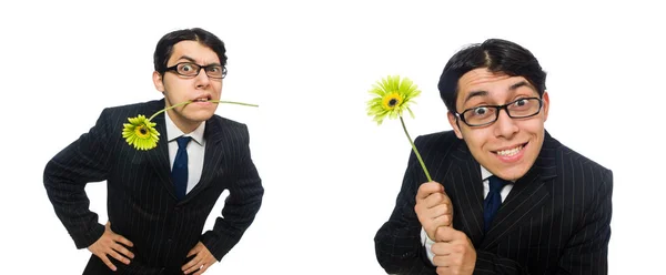 Jonge man in zwart kostuum met bloem geïsoleerd op wit — Stockfoto