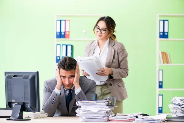 Man employee suffering from excessive work — Stock Photo, Image