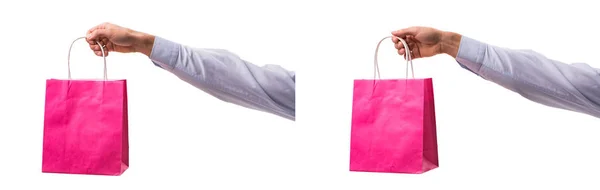 Ruční držení nákupní tašky s vánočními nákupy na bílém zádech — Stock fotografie