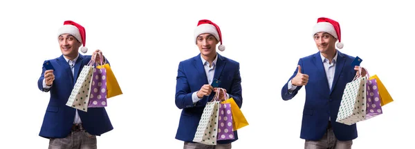 Ung man med väskor efter jul shopping på vit bakgrund — Stockfoto