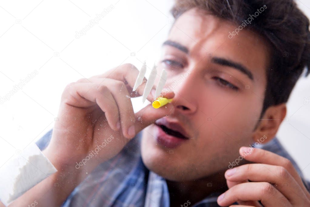 Drug addict sniffing cocaine narcotic