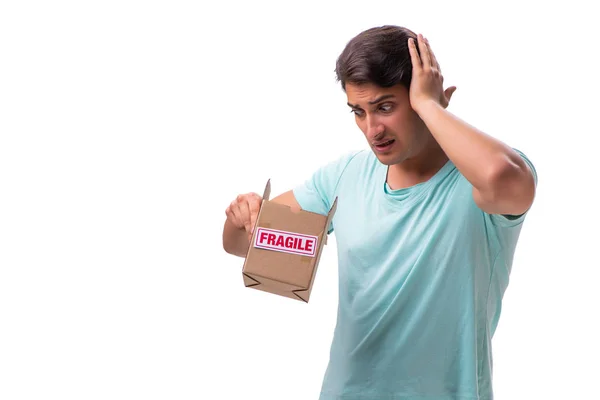 Young handsome man with fragile box ordered from Internet — Stock Photo, Image