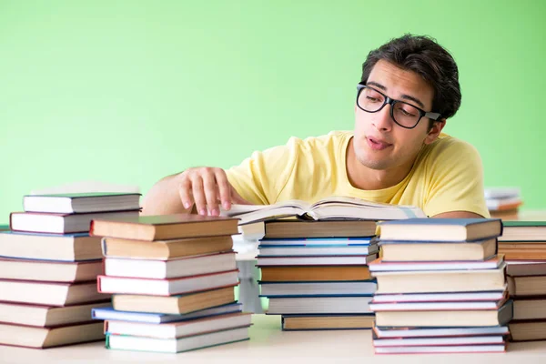 Student with too many books to read before exam — Stock Photo, Image