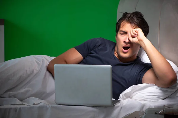 Young handsome man suffering from insomnia at home — Stock Photo, Image