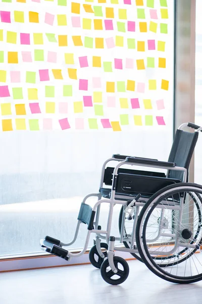 Young handsome man in wheelchair with many conflicting prioritie — Stock Photo, Image